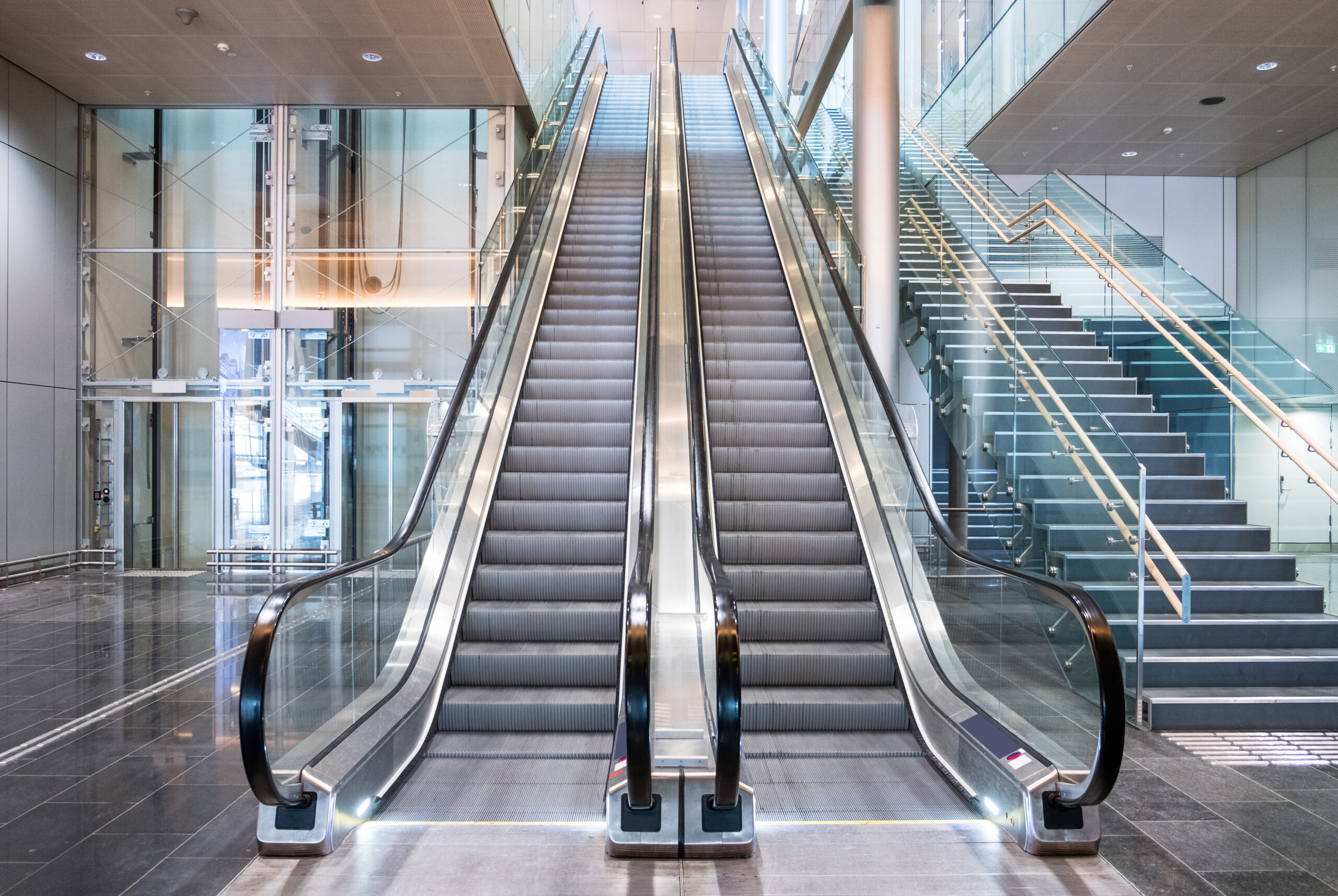 Modern luxury escalators with staircase at airport