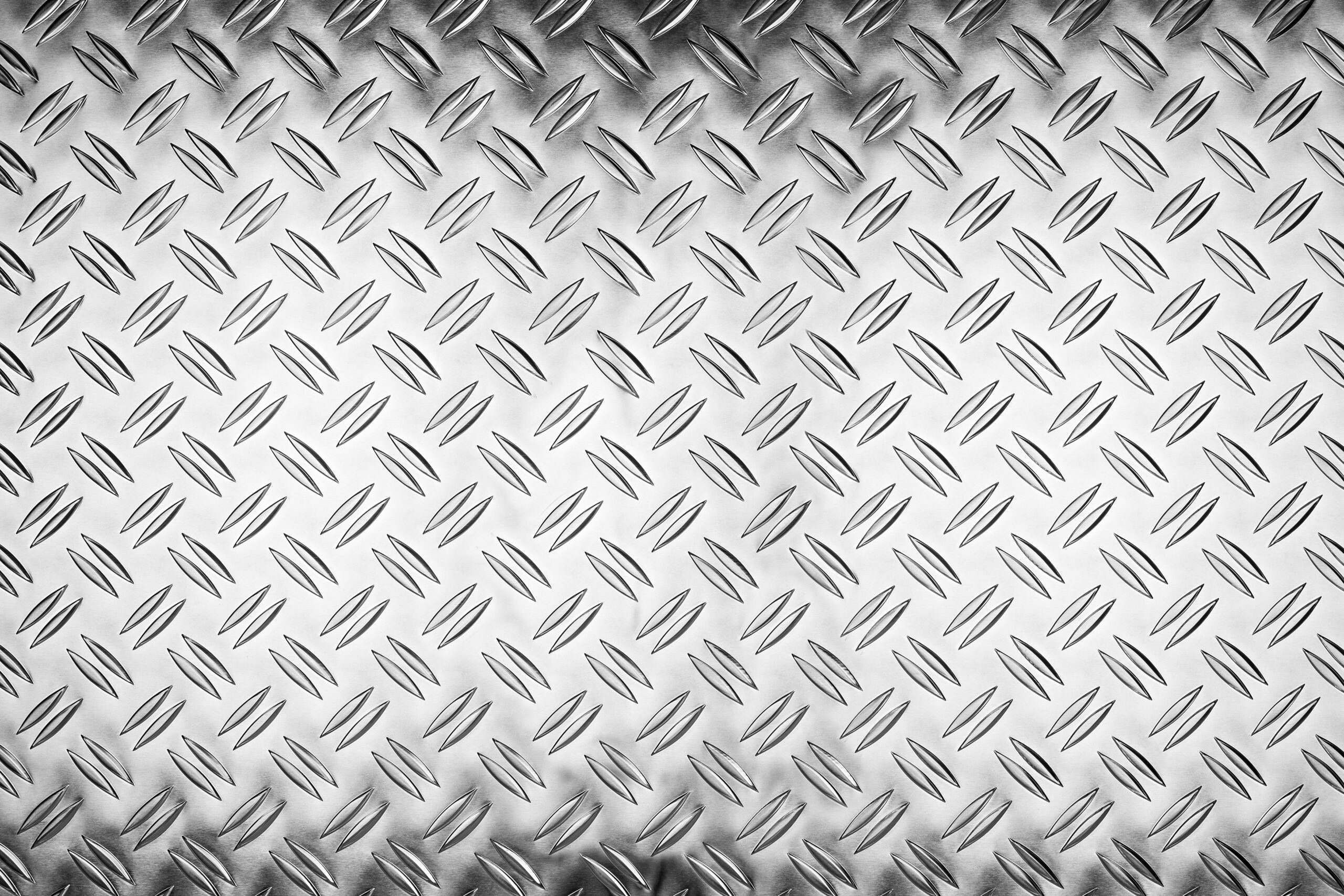 shiny polished aluminum diamond plate metal texture background empty with copy space design pattern background