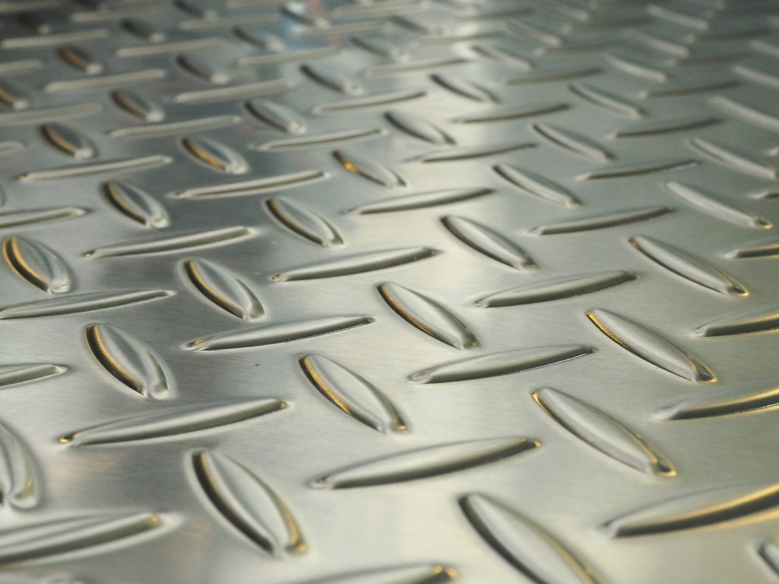 Close up image of Texture of metal steel diamond plate for Background.